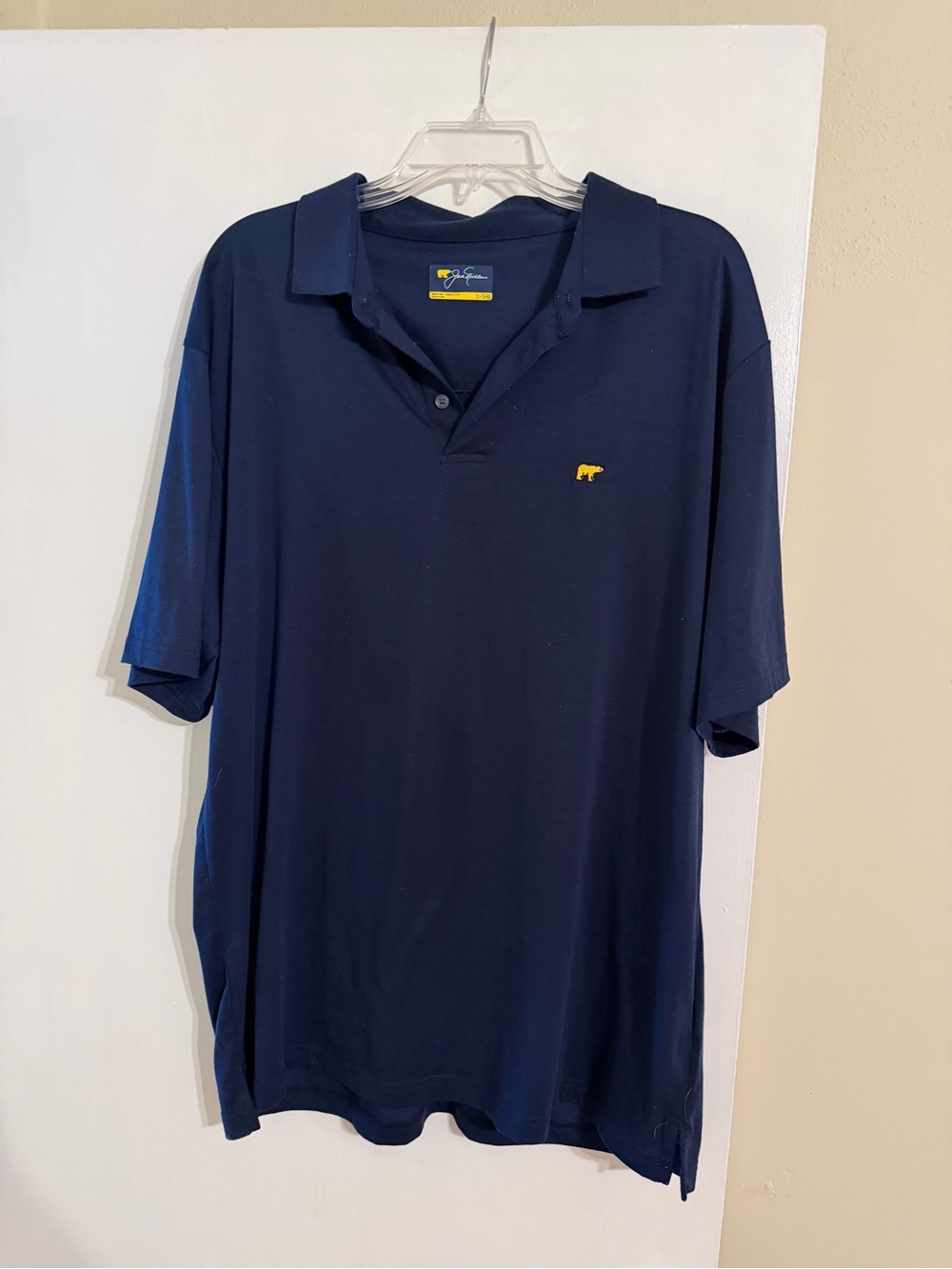 Men's Navy Polo with Small Yellow Embroidered Icon
